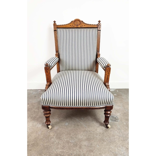 238 - AESTHETIC ARMCHAIR, Victorian oak and ebonised, circa 1870, in blue and white ticking on ceramic cas... 