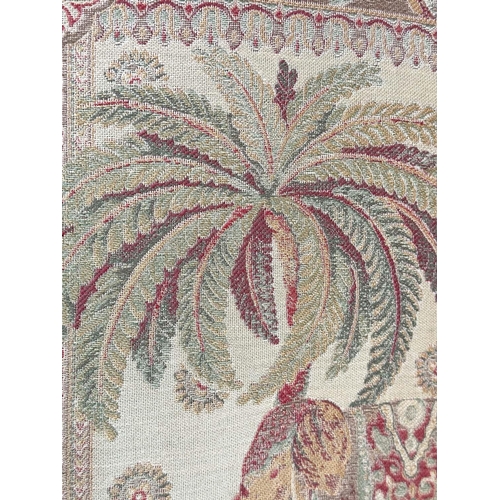 263 - SCREEN, three fold arched 'Raj' fabric, upholstered with elephants and palm trees and brass studded,... 