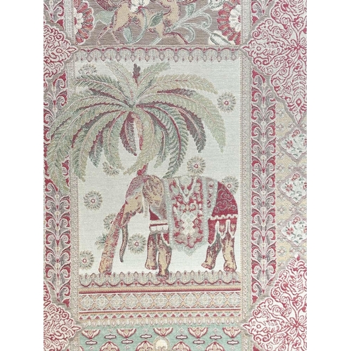 263 - SCREEN, three fold arched 'Raj' fabric, upholstered with elephants and palm trees and brass studded,... 