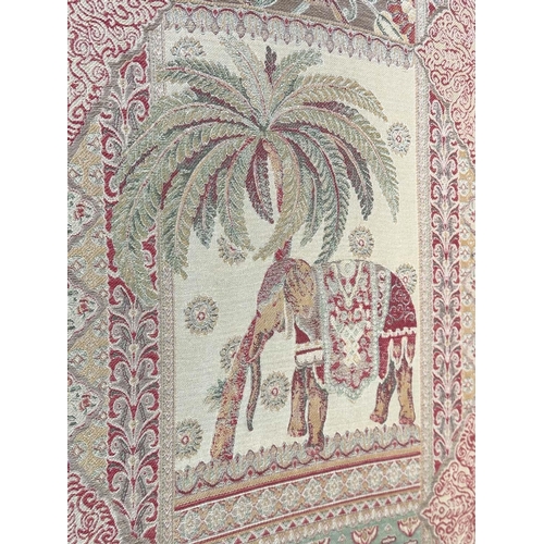 263 - SCREEN, three fold arched 'Raj' fabric, upholstered with elephants and palm trees and brass studded,... 