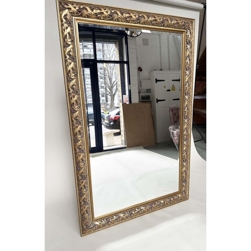 266 - WALL MIRROR, rectangular gilt composition with pierced foliate frame, 176cm H x 114cm.