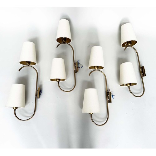 282 - HEATHFIELD & CO WALL SCONCES, a set of four, bent gilt metal each with two branches and conical shad... 