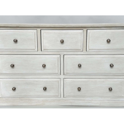 290 - LOW CHEST, Gothic design traditionally grey painted with seven drawers, 140cm W x 43cm D x 79cm H.