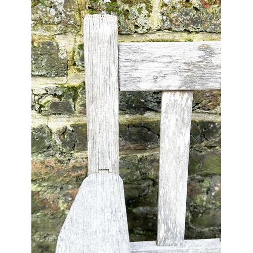 397 - GARDEN BENCH, silvery weathered teak of slatted construction, 130cm W, by 'Lister'.