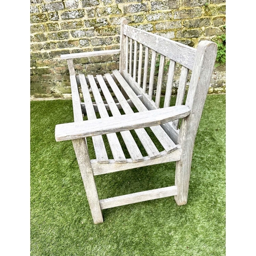 397 - GARDEN BENCH, silvery weathered teak of slatted construction, 130cm W, by 'Lister'.