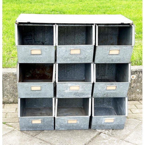 398 - STACKING TRAYS, a set of nine, galvanised with softwood work top, 90cm x 50cm x 91cm H.