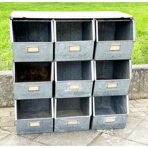 398 - STACKING TRAYS, a set of nine, galvanised with softwood work top, 90cm x 50cm x 91cm H.