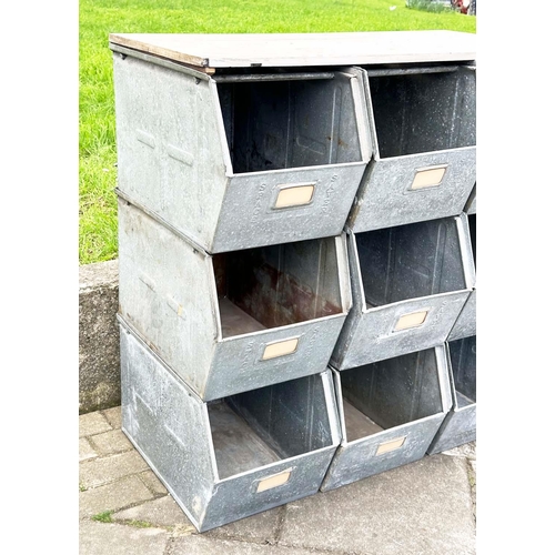 398 - STACKING TRAYS, a set of nine, galvanised with softwood work top, 90cm x 50cm x 91cm H.