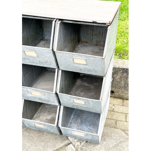 398 - STACKING TRAYS, a set of nine, galvanised with softwood work top, 90cm x 50cm x 91cm H.