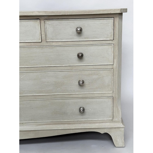 296 - LOW CHEST, Georgian style traditionally grey painted with nine drawers, canted angles and bracket su... 