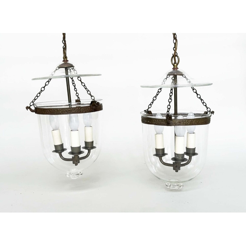 405 - HALL LANTERNS, a pair, glass and bronzed metal each with three lights, 40cm H x 23cm. (2)