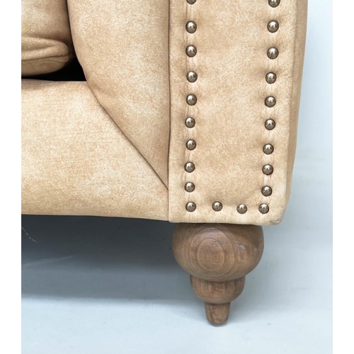 425 - CHESTERFIELD ARMCHAIR, deep buttoned nubuck light tan leather with turned supports, 116cm x 73cm H.