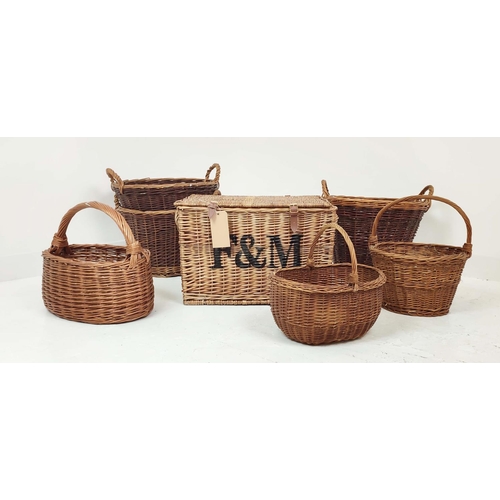 320 - BASKETS, a set of seven, wicker in various sizes, to include a picnic hamper, 40cm H x 60cm x 40cm D... 