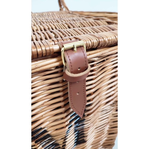 320 - BASKETS, a set of seven, wicker in various sizes, to include a picnic hamper, 40cm H x 60cm x 40cm D... 