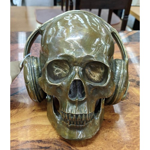 334 - CONTEMPORARY SCHOOL SCULPTURAL STUDY, DJ skull, bronzed metal, 17cm H.