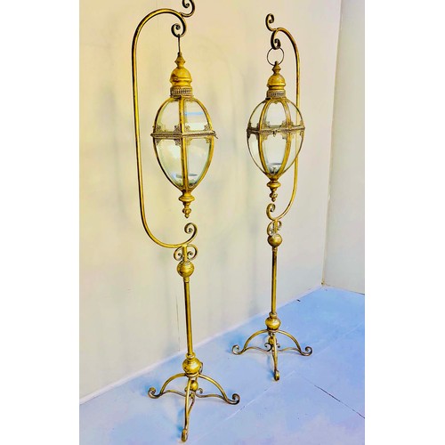 350 - LANTERNS ON STANDS, a pair, regency style, gilt metal, 163cm H x 35cm x 33cm. (2)