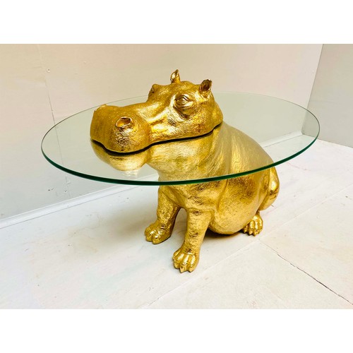 355 - HIPPOPOTAMUS TABLE, glass top gilt resin base, 65cm H x 45cm x 50cm L.