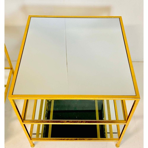 363 - SIDE TABLES, a pair, gilt metal frames with three glass shelves, 56cm H x 51cm x 51cm. (2)