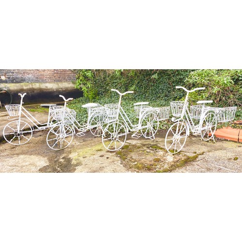 373 - BICYCLE PLANTERS, a set of four, white painted metal, 63cm H x 88cm x 44cm. (4)