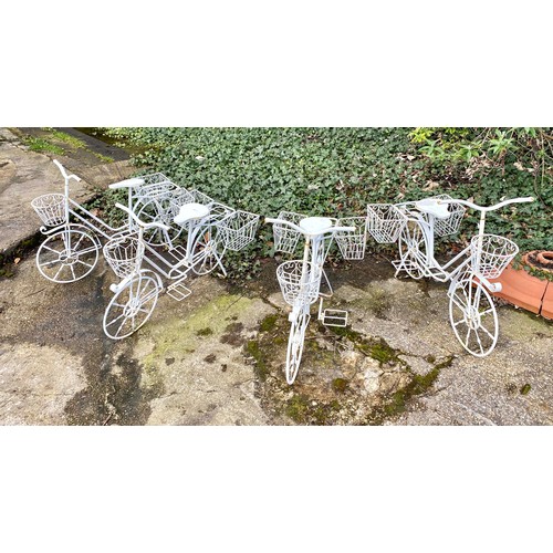 373 - BICYCLE PLANTERS, a set of four, white painted metal, 63cm H x 88cm x 44cm. (4)