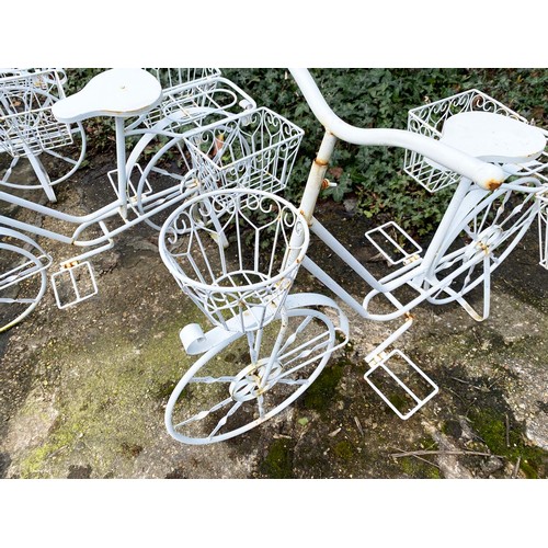 373 - BICYCLE PLANTERS, a set of four, white painted metal, 63cm H x 88cm x 44cm. (4)