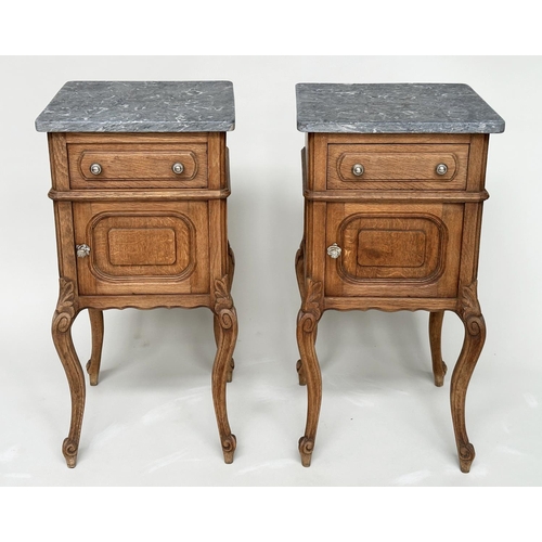 221 - BEDSIDE CABINETS, a pair, 19th century French oak, each with drawer, and panelled door with grey mar... 