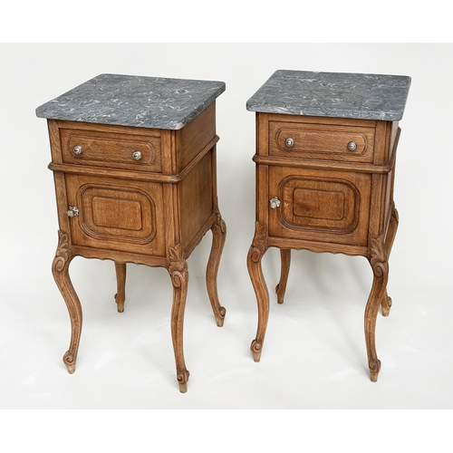 221 - BEDSIDE CABINETS, a pair, 19th century French oak, each with drawer, and panelled door with grey mar... 