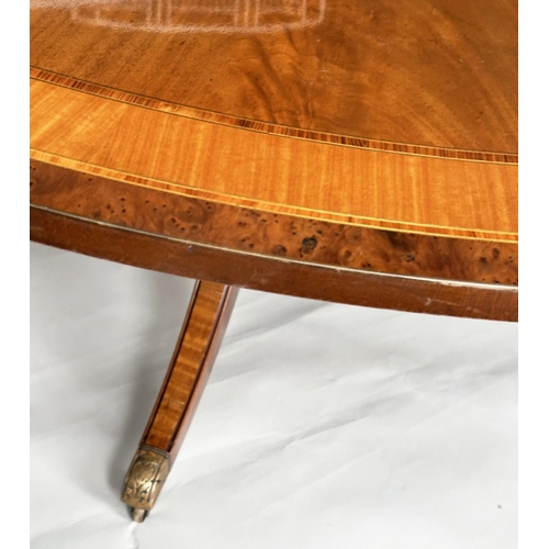 228 - DINING TABLE, circular Regency style radially veneered mahogany and satinwood crossbanded with outsw... 