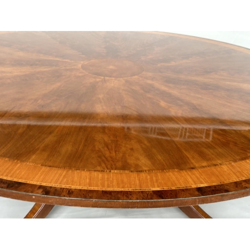 228 - DINING TABLE, circular Regency style radially veneered mahogany and satinwood crossbanded with outsw... 