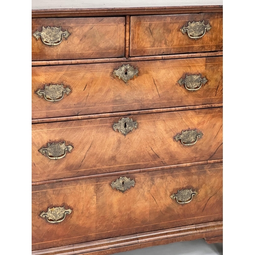 223 - CHEST, early 18th century English Queen Anne figured walnut, crossbanded and line inlaid with two sh... 