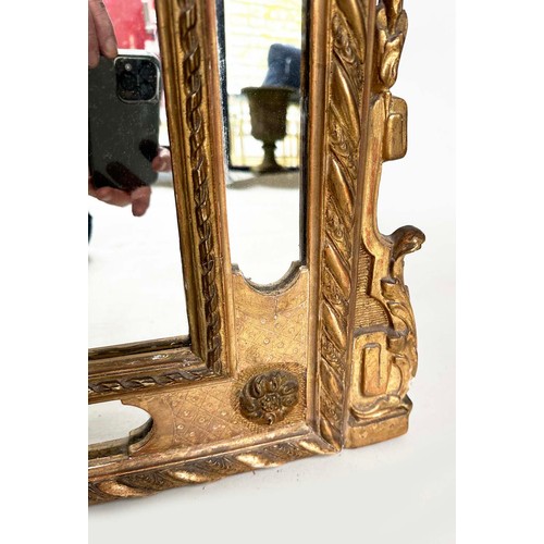 224 - WALL MIRROR, 19th century French giltwood and gesso moulded, arched with marginal mirror plates and ... 