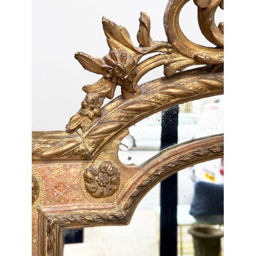 224 - WALL MIRROR, 19th century French giltwood and gesso moulded, arched with marginal mirror plates and ... 