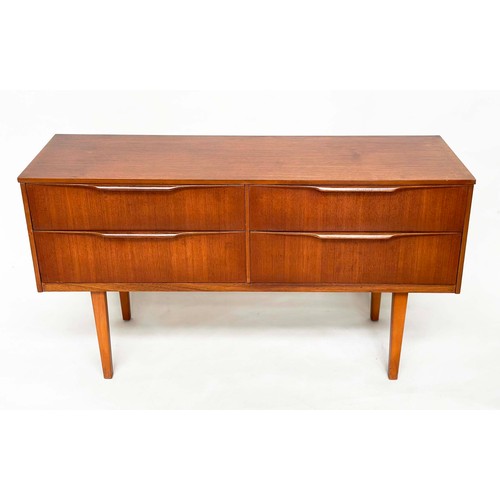 311 - AUSTIN SUITE LOW CHEST, 1970s teak with four drawers, 128cm W x 70cm H x 41cm D.