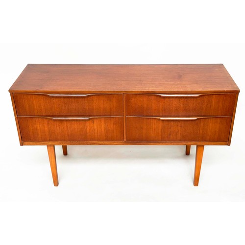 311 - AUSTIN SUITE LOW CHEST, 1970s teak with four drawers, 128cm W x 70cm H x 41cm D.