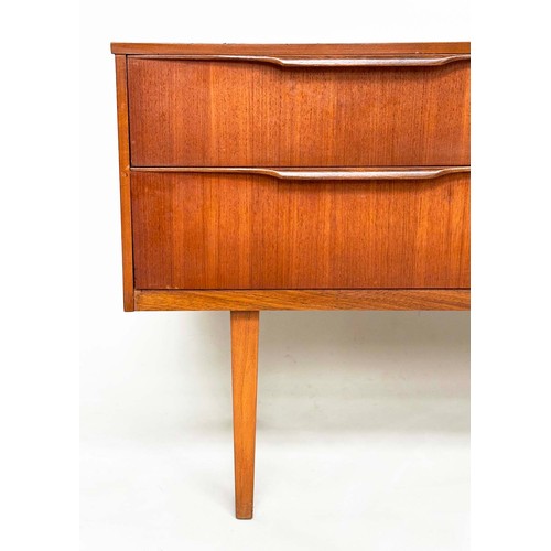 311 - AUSTIN SUITE LOW CHEST, 1970s teak with four drawers, 128cm W x 70cm H x 41cm D.