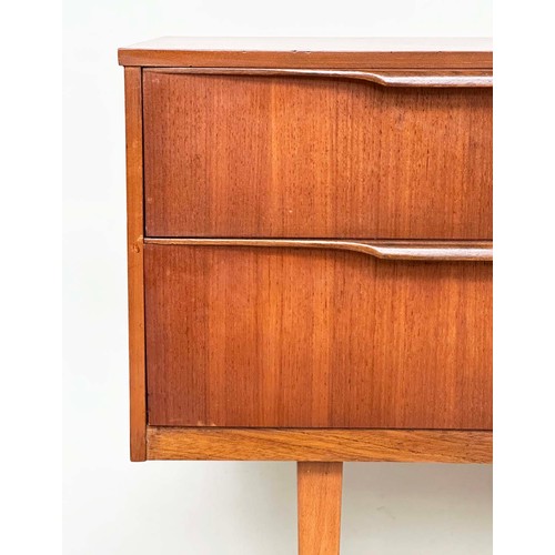 311 - AUSTIN SUITE LOW CHEST, 1970s teak with four drawers, 128cm W x 70cm H x 41cm D.