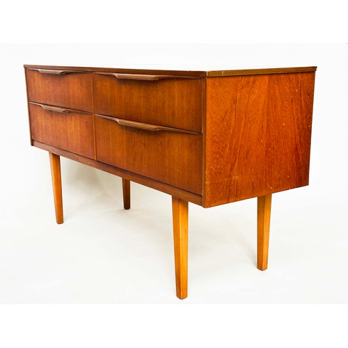 311 - AUSTIN SUITE LOW CHEST, 1970s teak with four drawers, 128cm W x 70cm H x 41cm D.