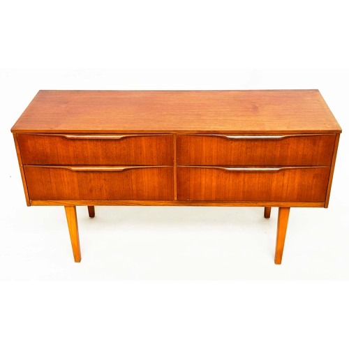 311 - AUSTIN SUITE LOW CHEST, 1970s teak with four drawers, 128cm W x 70cm H x 41cm D.