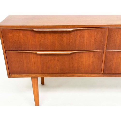 311 - AUSTIN SUITE LOW CHEST, 1970s teak with four drawers, 128cm W x 70cm H x 41cm D.