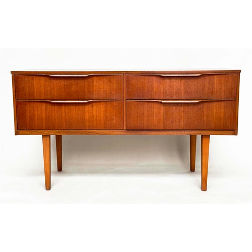 311 - AUSTIN SUITE LOW CHEST, 1970s teak with four drawers, 128cm W x 70cm H x 41cm D.