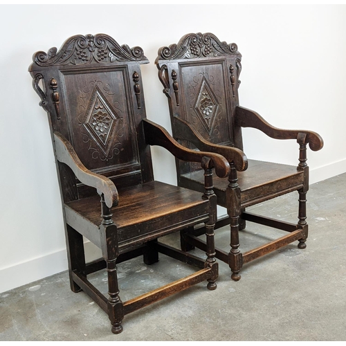 261 - WAINSCOT ARMCHAIRS, a pair, late 19th century Carolean style oak with carved backs, 119cm H x 61cm x... 