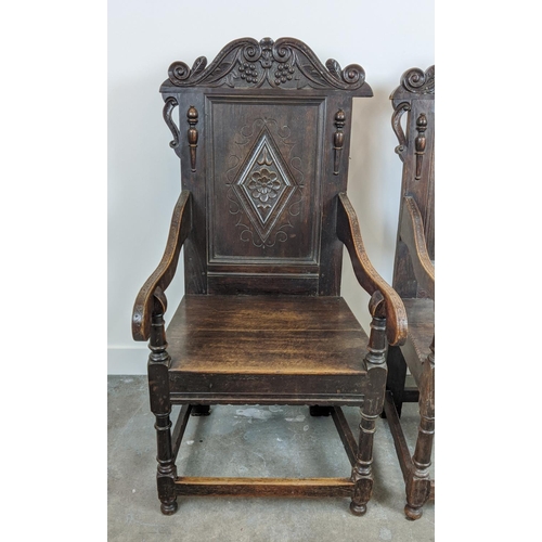 261 - WAINSCOT ARMCHAIRS, a pair, late 19th century Carolean style oak with carved backs, 119cm H x 61cm x... 