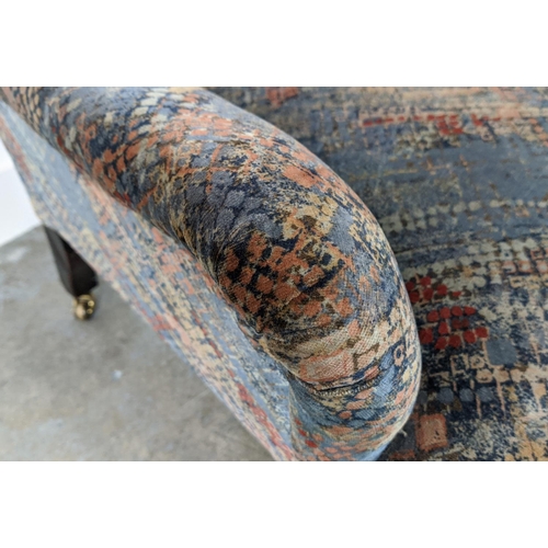 243 - ARMCHAIR, late Victorian mahogany in patterned grey velvet on brass castors, 78cm H x 65cm x 74cm.