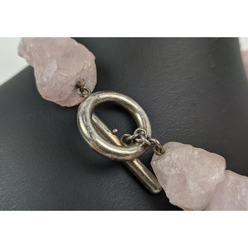 16 - ELENA VOTSI NECKLACES, comprising one in amethyst and the other in rose quartz, each with a silver c... 