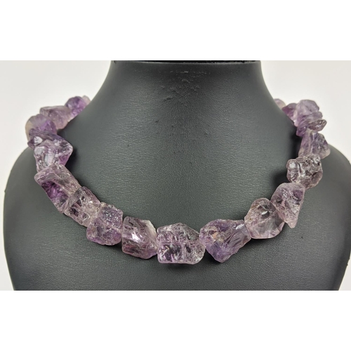 16 - ELENA VOTSI NECKLACES, comprising one in amethyst and the other in rose quartz, each with a silver c... 