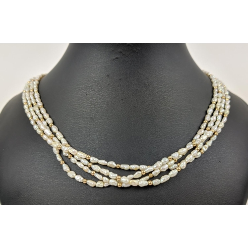 18 - A FOUR STRAND RICE PEARL NECKLACE, with a gold ball clasp, a 9ct gold gatelink bracelet, etc