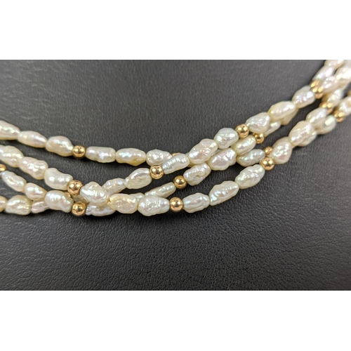 18 - A FOUR STRAND RICE PEARL NECKLACE, with a gold ball clasp, a 9ct gold gatelink bracelet, etc