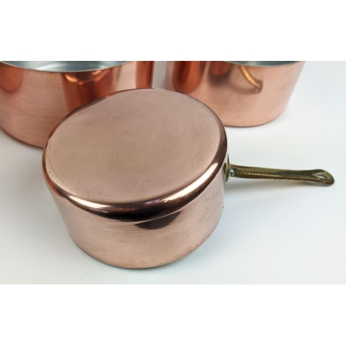 241 - BATTERIE DE CUISINE, a graduated set of twelve, copper pans, with brass handles. (12)