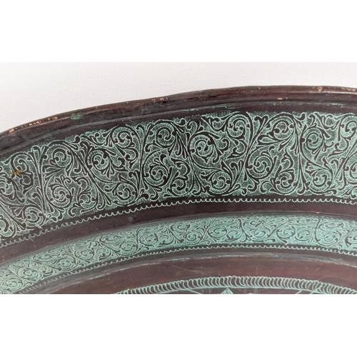 6 - NEAR EASTERN COPPER CHARGER, incised Islamic decoration, 96cm diam.