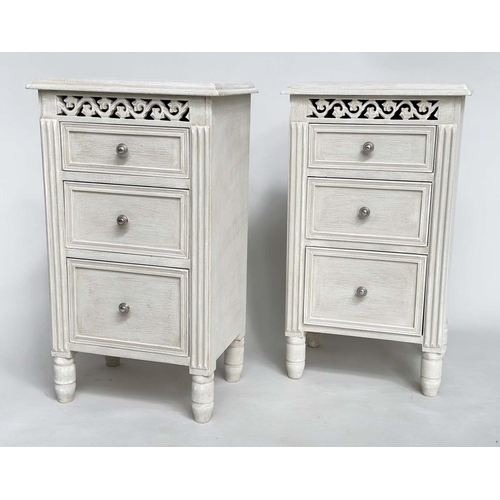 204 - BEDSIDE CHESTS, a pair, French style grey painted each with three drawers and pierced frieze, 40cm x... 